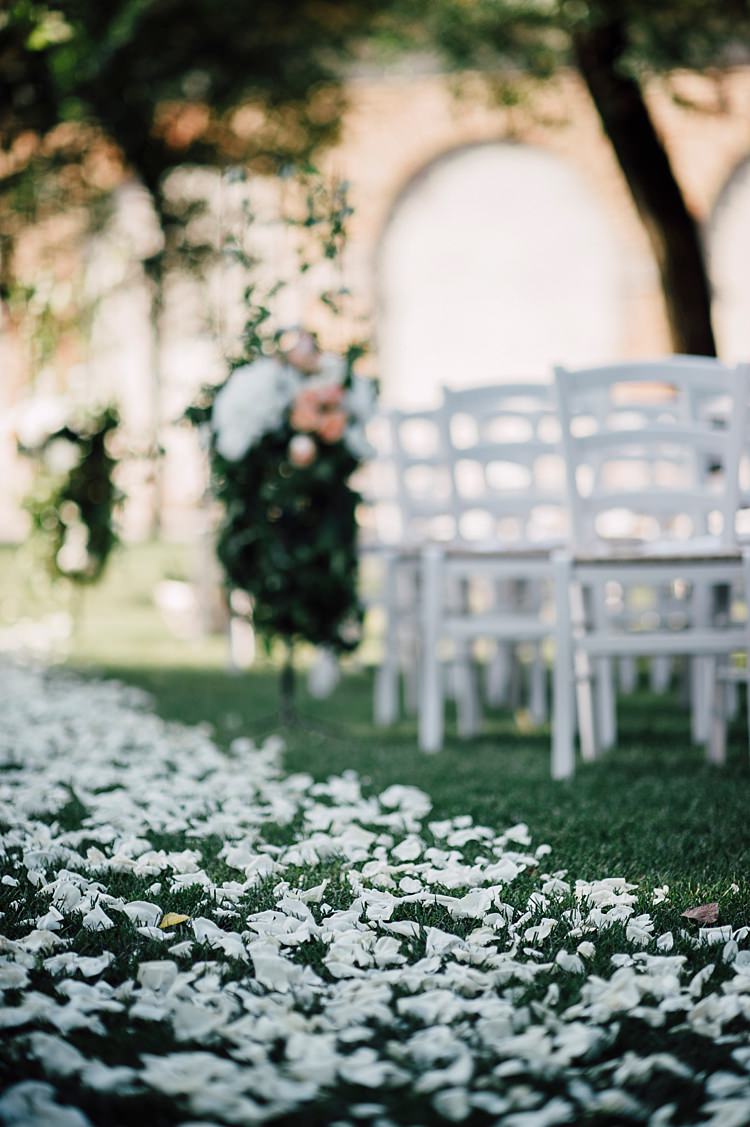 Ceremony White Petals Aisle White Chairs Florals Greenery Outdoor Floral Countryside Wedding Veneto http://serenagenovese.com/