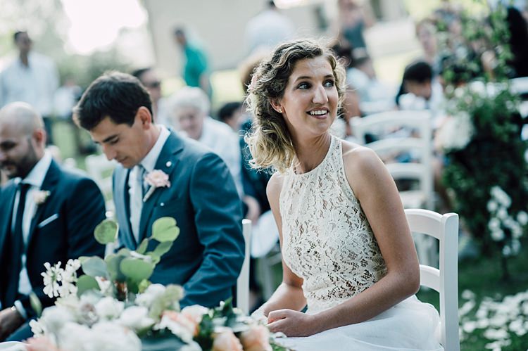 Ceremony Bride Lace Halter-Neck Top Tulle Skirt Groom Grey Suit Silver Tie White Peach Florals Outdoor Floral Countryside Wedding Veneto http://serenagenovese.com/