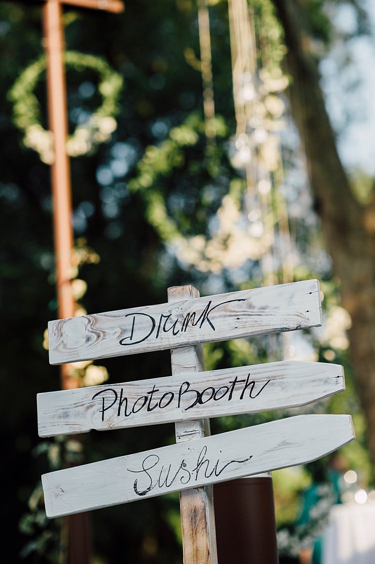 White Wooden Reception Sign Handwritten Hanging Floral Wreaths Outdoor Floral Countryside Wedding Veneto http://serenagenovese.com/