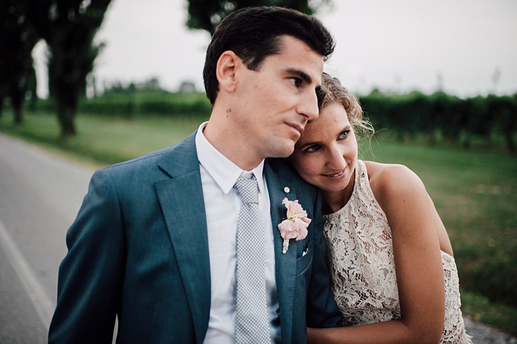 Bride Lace Halter-Neck Top Tulle Skirt Groom Grey Suit Silver Tie Pink Floral Buttonhole Tree Lined Road Outdoor Floral Countryside Wedding Veneto http://serenagenovese.com/