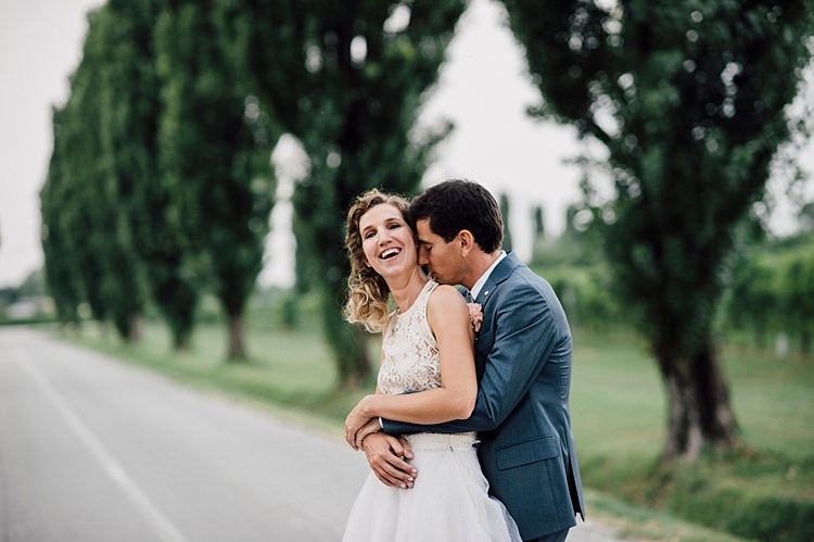Bride Lace Halter-Neck Top Tulle Skirt Groom Grey Suit Tree Lined Road Outdoor Floral Countryside Wedding Veneto http://serenagenovese.com/
