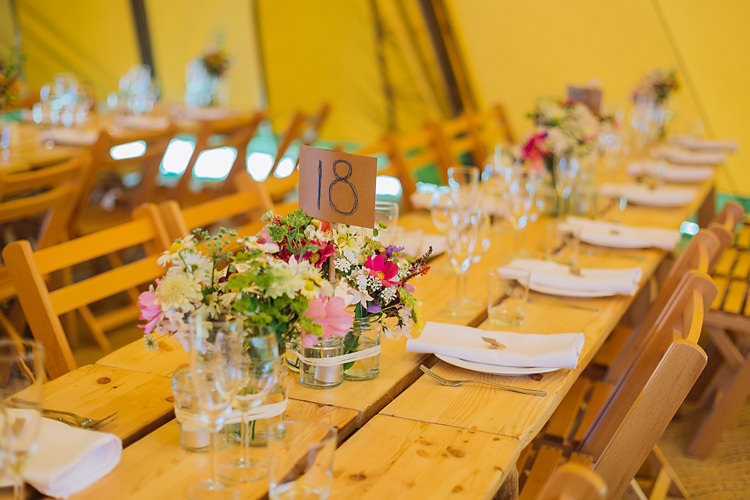 Jar Flowers Rustic Tables Fun & Games Tipi Wedding http://jamesandlianne.com/