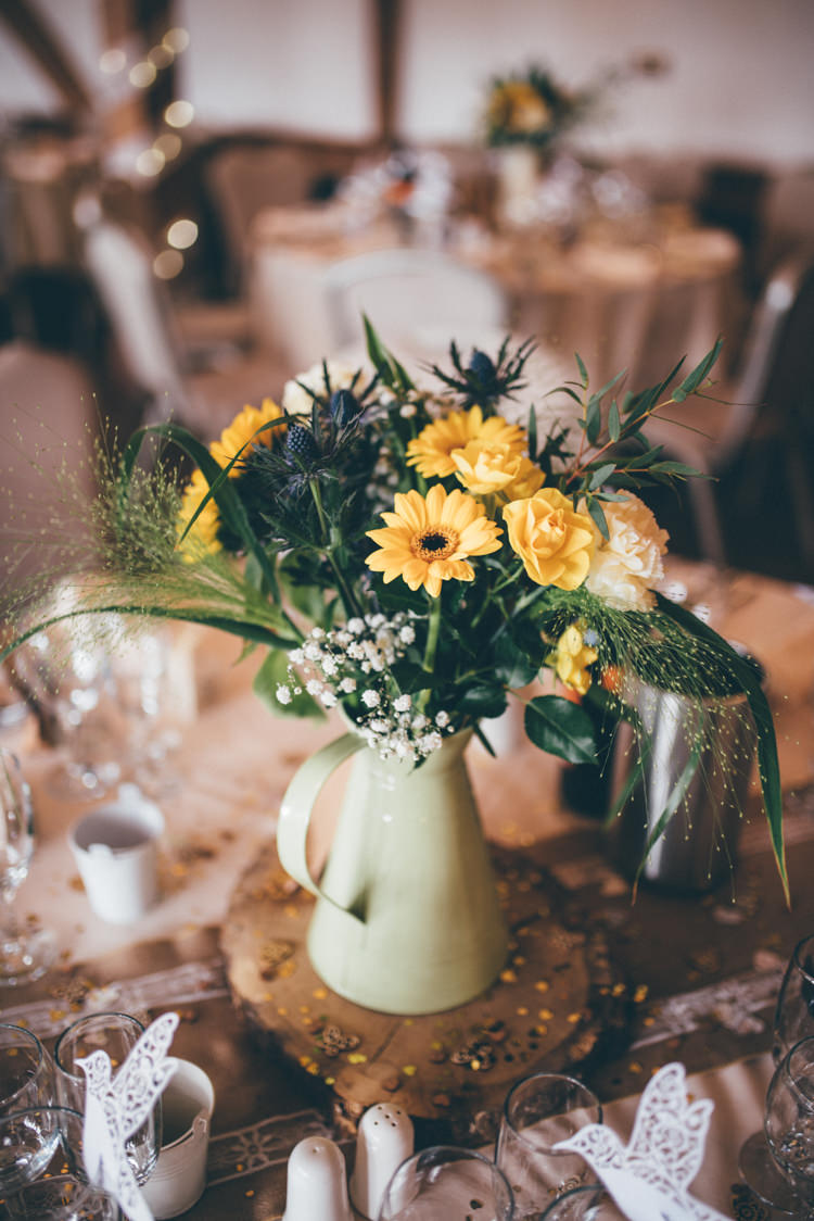Jug Centrepiece Log Decor Hessian Tables Outdoorsy Rustic Sunflowers Wedding http://www.helenjanesmiddy.com/