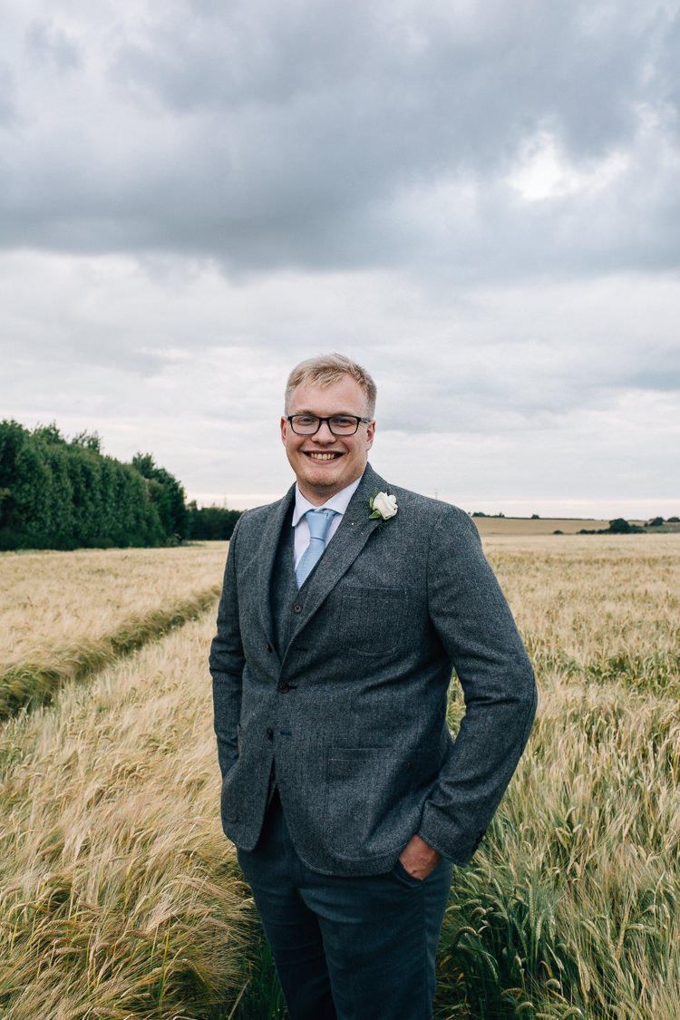 Grey Suit Groom Style Floral Marquee Summer Wedding http://matildadelvesweddingphotography.com/