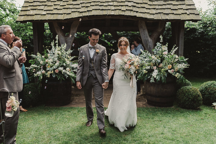 Ceremony Flowers Barrels Backdrop Aisle Whimsical Floral Blush Grey Wedding https://www.scuffinsphotography.com/