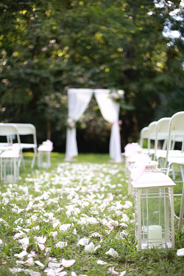 Outdoor Ceremony White Curtains Glass Candle Lantern Flower Petals White Chairs Soft Romantic Woodland Wedding Tennessee http://www.jessicaleephotographicart.com/