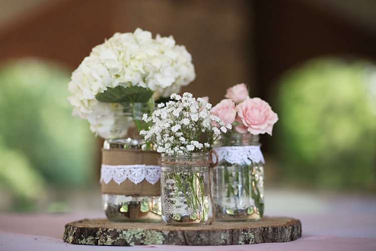 Floral Décor White Hydrangea Pink Roses Baby's Breath Glass Jars Burlap Lace Trim Round Wooden Tree Slice Soft Romantic Woodland Wedding Tennessee http://www.jessicaleephotographicart.com/