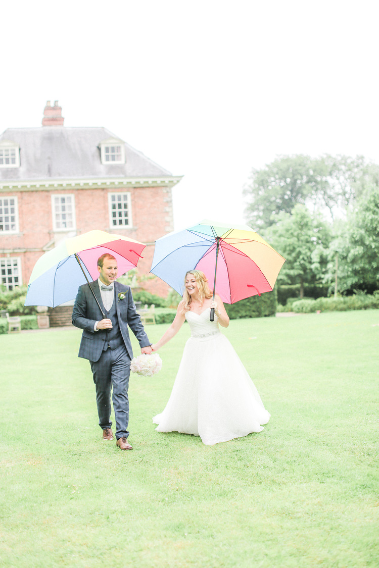 Umbrellas Rainy Romantic Pink Summer Glamping Wedding http://helenrussellphotography.co.uk/