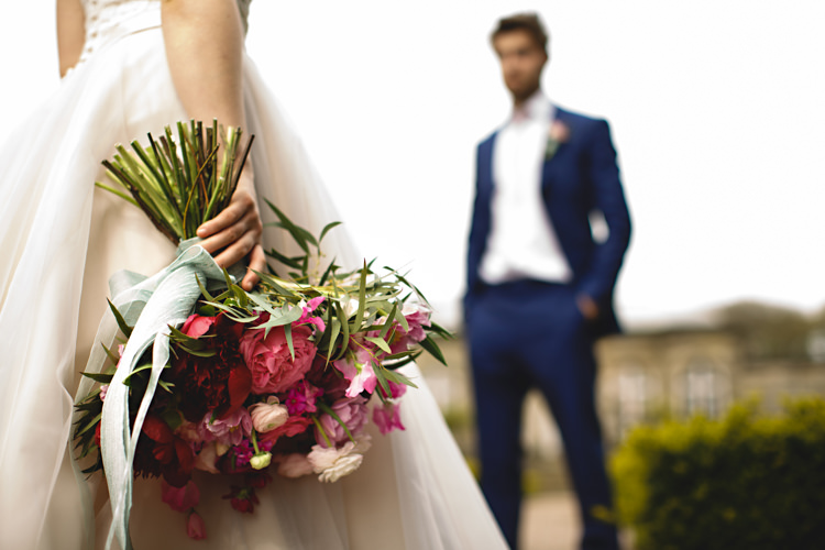 Bouquet Flowers Bride Bridal Red Burgundy Pink Rose Ribbon Opulent Rich Tipi Wedding Ideas http://hbaphotography.com/