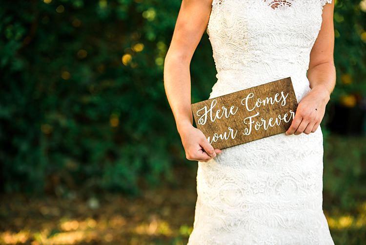 Bride Lace Bridal Gown With Buttons Wooden Sign White Calligraphy Trees Ethereal Boho Wedding Ideas http://perfectcapturephoto.com/