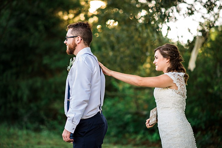First Look Bride Lace Bridal Gown With Buttons Soft Curls Hairstyle Groom Navy Pants Suspenders Glasses Trees Grass Ethereal Boho Wedding Ideas http://perfectcapturephoto.com/