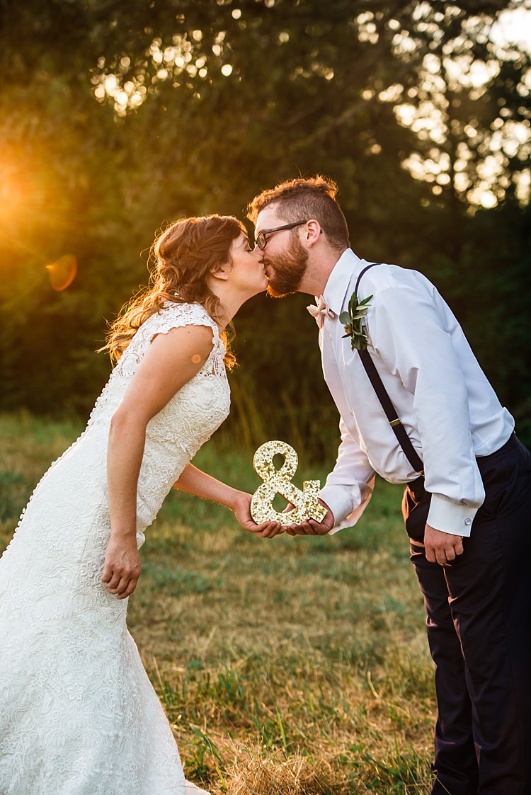 Bride Lace Bridal Gown With Buttons Soft Curls Hairstyle Groom Navy Pants Suspenders Cream Bow Tie Greenery Buttonhole Gold Metallic And Sign Trees Grass Ethereal Boho Wedding Ideas http://perfectcapturephoto.com/