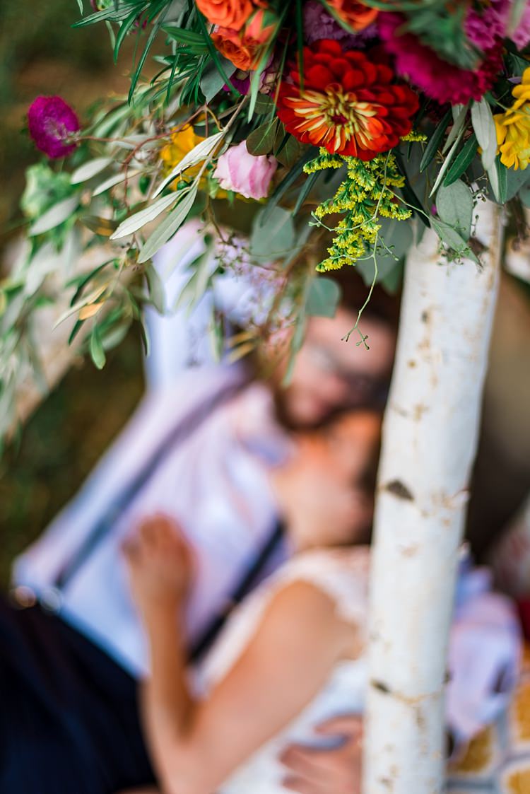 Teepee Multicoloured Florals Pink Red Yellow Orange Bride Groom Ethereal Boho Wedding Ideas http://perfectcapturephoto.com/