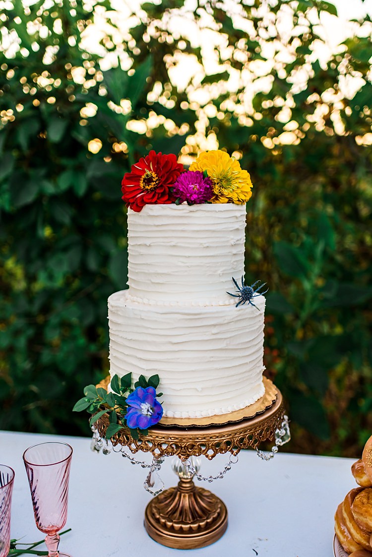 Wedding Cake Multicoloured Florals Red Yellow Pink Purple Delphinium Gerbra Gold Stand Ethereal Boho Wedding Ideas http://perfectcapturephoto.com/
