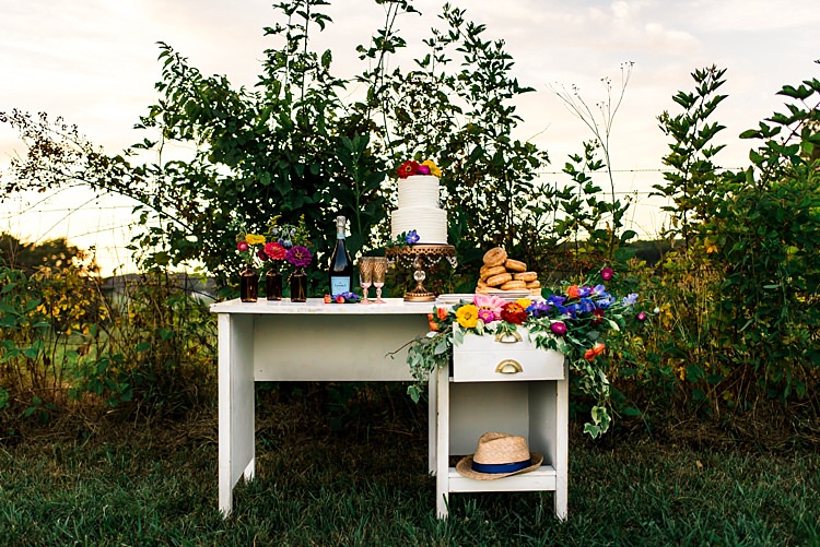 Dessert Table Decorated With Multicoloured Florals Brown Glass Vases Wedding Cake Gold Stand Donuts Wine Ethereal Boho Wedding Ideas http://perfectcapturephoto.com/