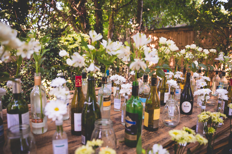 Bottle Flowers Table Decor Magical Outdoor Garden Festival Wedding http://realsimplephotography.net/