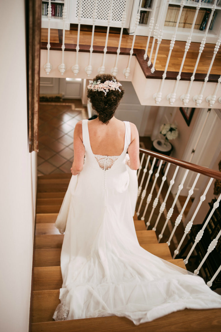 Bride Round Neck Low Back Crepe Tulle Bridal Gown Floral Hair Piece Staircase Romantic Bohemian Spain Wedding http://saralobla.com/