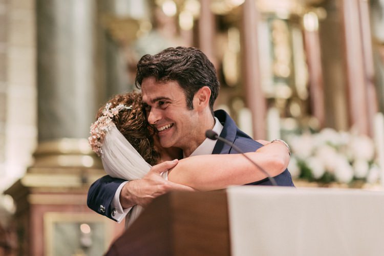 Church Ceremony Bride Floral Hairpiece Veil Groom Navy Blue Suit Hugs Romantic Bohemian Spain Wedding http://saralobla.com/