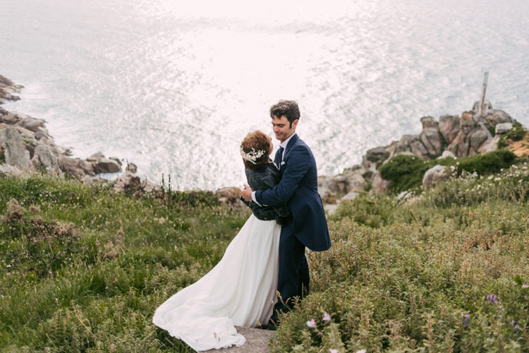 Bride Crepe Tulle Bridal Gown Floral Hairpiece Leather Jacket Groom Navy Blue Suit Grey Vest Polka Dot Tie Green Hills Ocean Romantic Bohemian Spain Wedding http://saralobla.com/