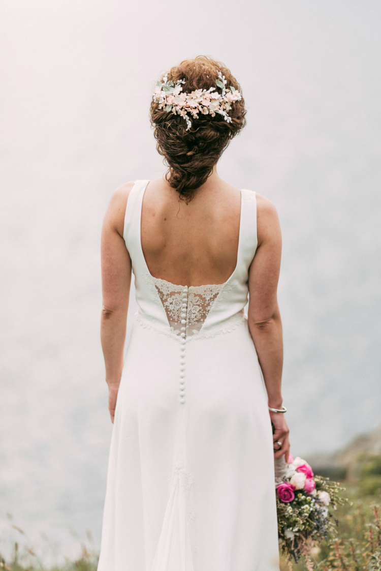 Bride Round Neck Low Back Crepe Tulle Bridal Gown Lace Buttons Floral Hairpiece Pastel Bouquet Roses Lavender Pink Cream Purple Ocean Romantic Bohemian Spain Wedding http://saralobla.com/