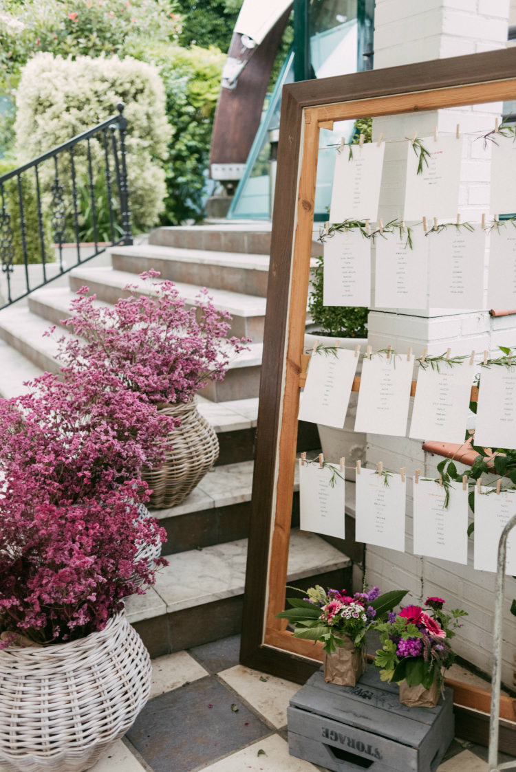 Reception Table Number Board Wooden Frame Pegs Greenery Potted Plants Romantic Bohemian Spain Wedding http://saralobla.com/