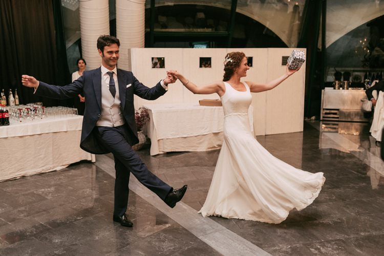 Reception Bride Round Neck Crepe Tulle Bridal Gown Floral Hairpiece Groom Navy Suit Grey Vest Polka Dot Tie Dancing Romantic Bohemian Spain Wedding http://saralobla.com/