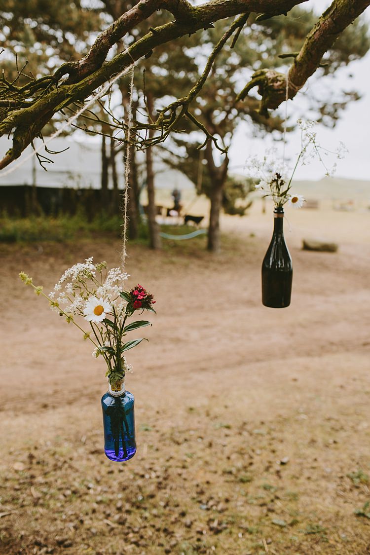 Hanging Bottle Flowers Beautiful Bohemian Beach Glamping Wedding http://www.thecurries.co/