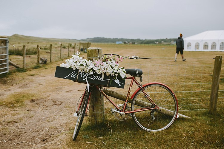Bicycle Bike Flowers Sign Beautiful Bohemian Beach Glamping Wedding http://www.thecurries.co/