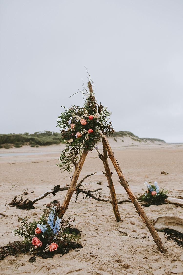 Ceremony Backdrop Drift Wood Branch Tipi Flowers Beautiful Bohemian Beach Glamping Wedding http://www.thecurries.co/