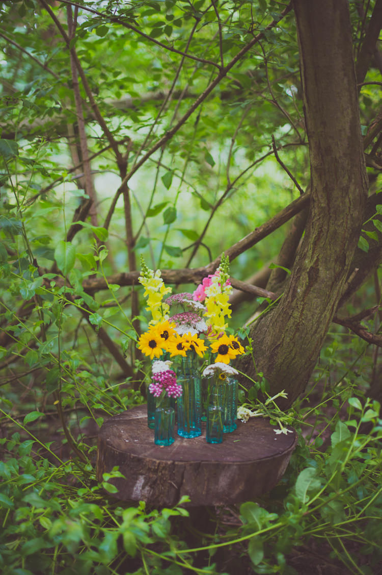 Bottle Flowers Log Slice Tree Stump Colourful Woodland Humanist Wedding http://sashaweddings.co.uk/ 