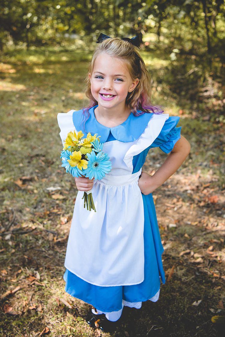 Flowergirl Alice Costume Pink Hair Highlights Black Bow Gerbera Yellow Blue Bouquet Alice in Wonderland Wedding Pennsylvania http://www.julieflorophotography.com/