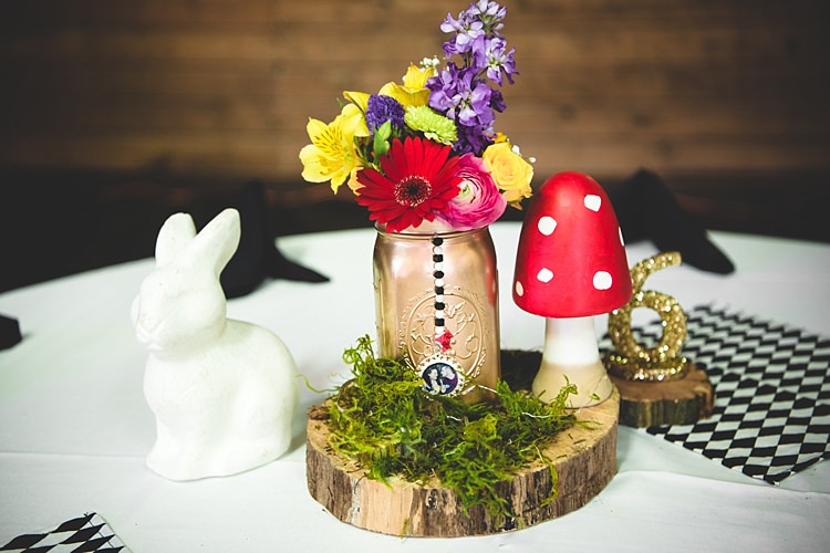 Reception Table Setting Tree Slice Gold Painted Mason Jar Multicoloured Florals Rabbit Mushroom Glitter Table Number Alice in Wonderland Wedding Pennsylvania http://www.julieflorophotography.com/