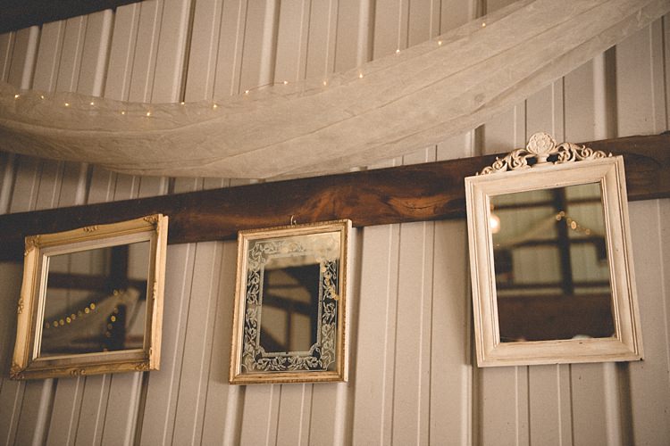 Reception Décor Hanging Fairy Lights White Tulle Framed Vintage Mirrors Alice in Wonderland Wedding Pennsylvania http://www.julieflorophotography.com/