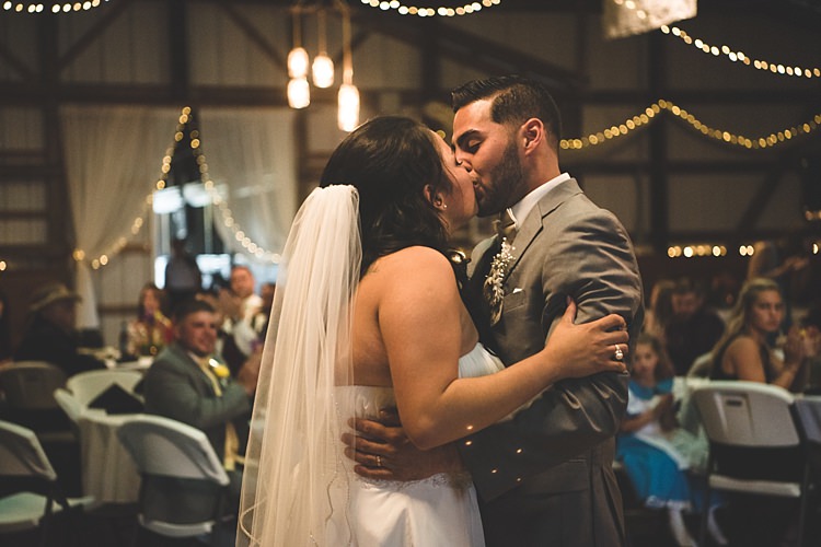 Reception Bride Strapless Gown With Train Veil Groom Grey Suit White Bowtie Dancing Kiss Guests Hanging Fairy Lights Tulle Alice in Wonderland Wedding Pennsylvania http://www.julieflorophotography.com/