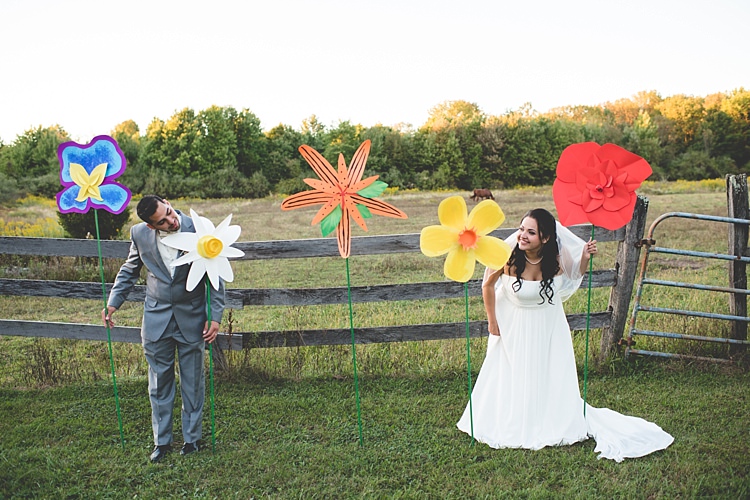 Bride Strapless Gown With Train Veil Groom Grey Suit White Bowtie Giant Colourful Paper Flowers Trees Wooden Fence Alice in Wonderland Wedding Pennsylvania http://www.julieflorophotography.com/