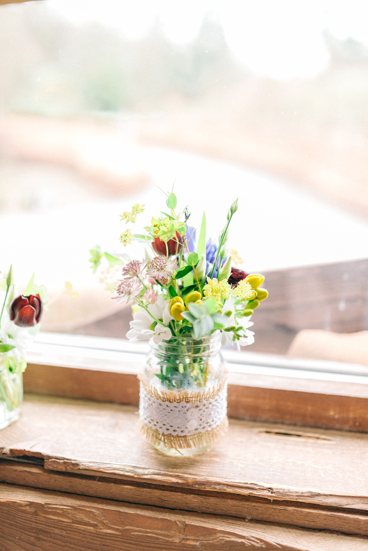 Hessian Lace Button Jar Flowers Magical Spring Treehouse Wedding http://sarahjaneethan.co.uk/