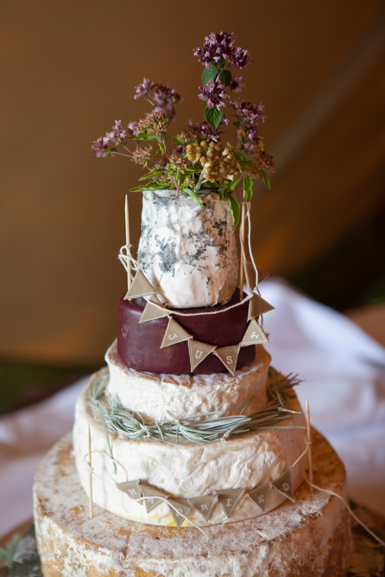 Cheese Tower Stack Cake Bunting Flowers Rustic Outdoor Rural Tipi Wedding http://emmastonerweddings.com/