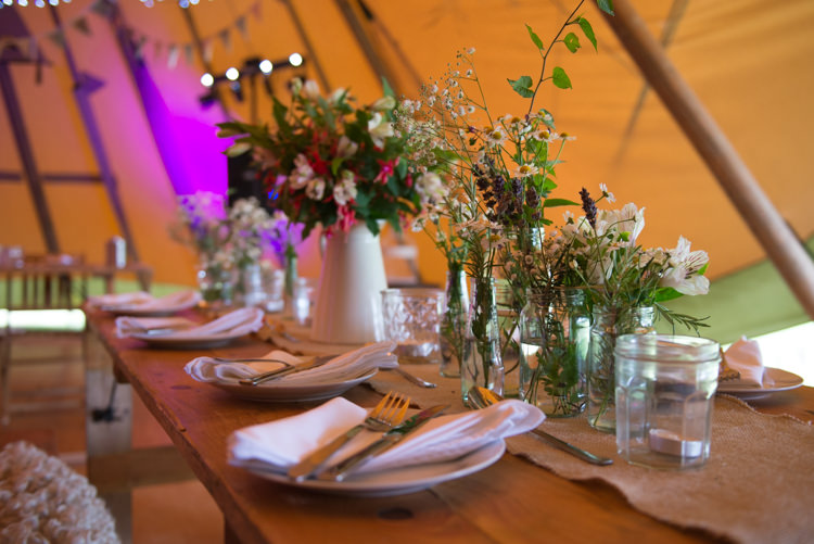 Wild Flowers Jars Decor Rustic Outdoor Rural Tipi Wedding http://emmastonerweddings.com/