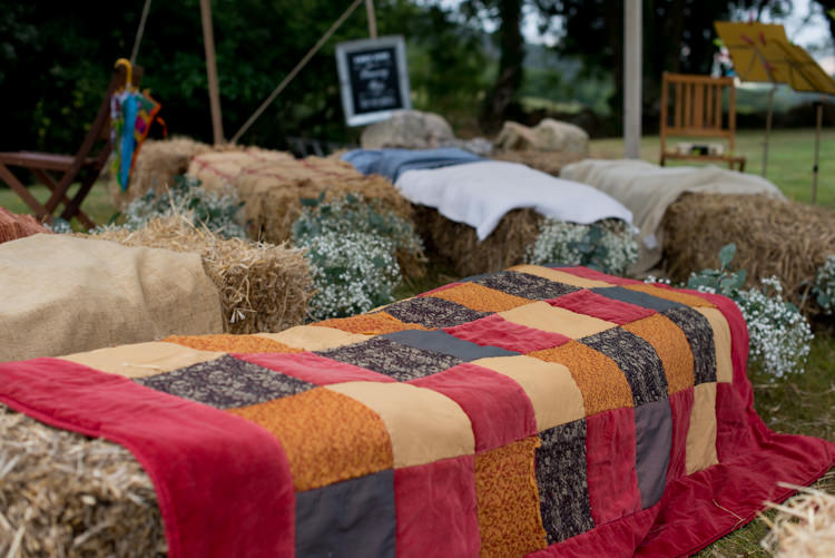 Hay Bale Seating Covers Flowers Rustic Outdoor Rural Tipi Wedding http://emmastonerweddings.com/