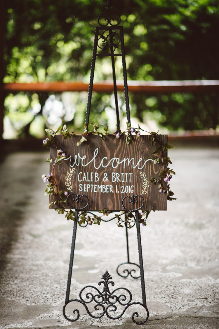 Wooden Welcome Sign White Calligraphy Floral Decoration Vintage Stand Magical Fairytale Forest Wedding Washington http://karissaroe.com/