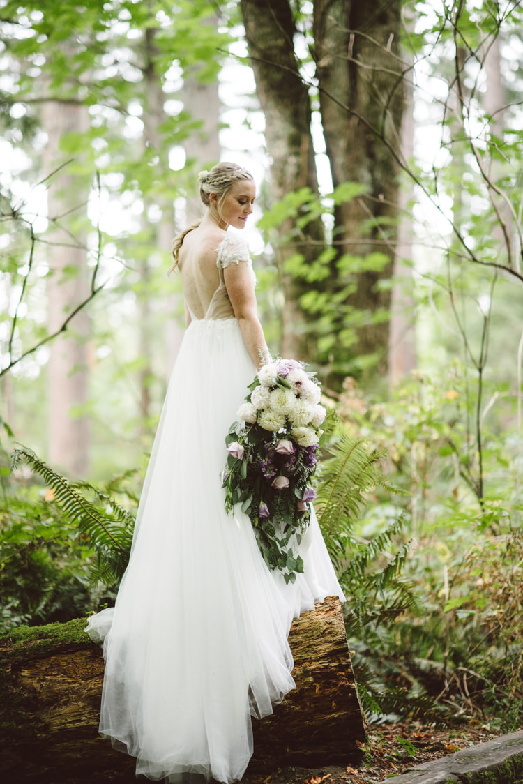 Bride Cap Sleeve Backless Tulle Bridal Gown Cascading Bouquet White Purple Chrysanthemum Roses Florals Braid Curly Ponytail Hairstyle Tree Trunk Magical Fairytale Forest Wedding Washington http://karissaroe.com/