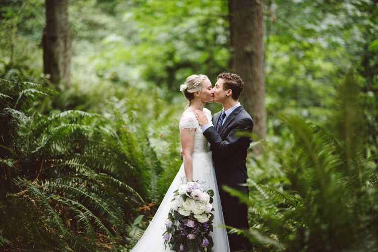 Bride Cap Sleeve Backless Tulle Bridal Gown Bouquet White Purple Chrysanthemum Roses Groom Charcoal Suit Patterned Purple Tie Kiss Greenery Trees Magical Fairytale Forest Wedding Washington http://karissaroe.com/