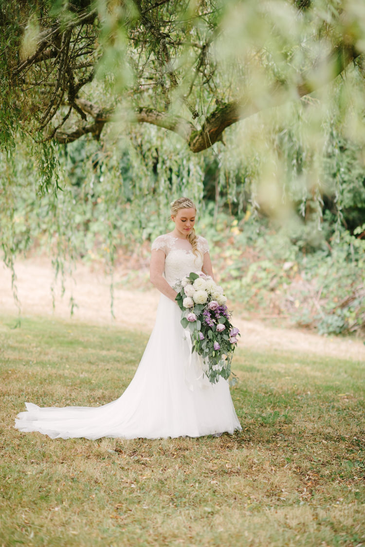 Bride Cap Sleeve Backless Tulle Bridal Gown Cascading Bouquet White Purple Chrysanthemums Roses Braid Curly Ponytail Trees Grass Magical Fairytale Forest Wedding Washington http://karissaroe.com/
