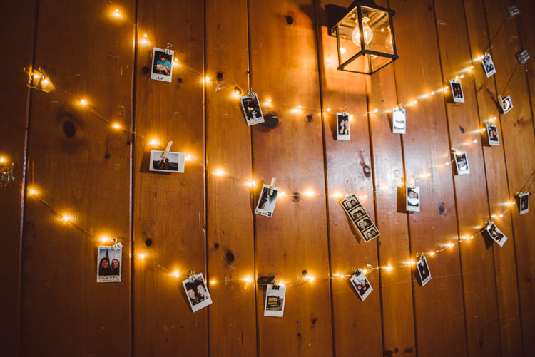 Reception Hanging Fairy Lights Polaroid Photos Pegs Wooden Wall Décor Magical Fairytale Forest Wedding Washington http://karissaroe.com/
