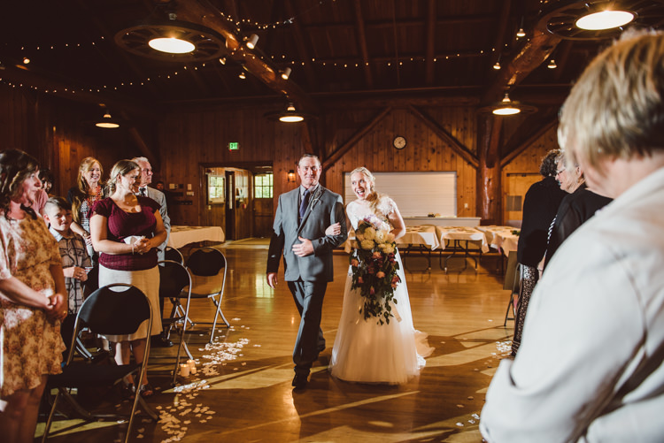 Wooden Hall Ceremony Bride Cap Sleeve Backless Tulle Bridal Gown Cascading Bouquet Father Entrance Guests Hanging Fairy Lights Magical Fairytale Forest Wedding Washington http://karissaroe.com/