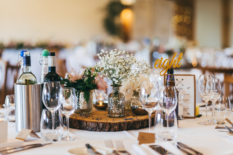 Centrepiece Log Slice Flowers Jars Relaxed Boho Barn Wedding http://www.fcphotography.co.uk/