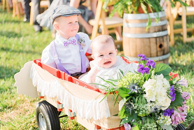 Outdoor Ceremony Ring Bearer Baby Decorated Cart Lace Fresh White Purple Florals Outdoor Spring Vineyard Wedding Tennessee http://www.juicebeatsphotography.com/