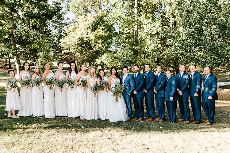 Bridal Party Bride Ivory Lace Tulle Wedding Gown Groom Navy Blue Suit Bridesmaids Groomsmen Bouquets Wild Florals Eucalyptus Outdoors Whimsical Boho Outdoor Wedding Alabama http://belightphotography.com/
