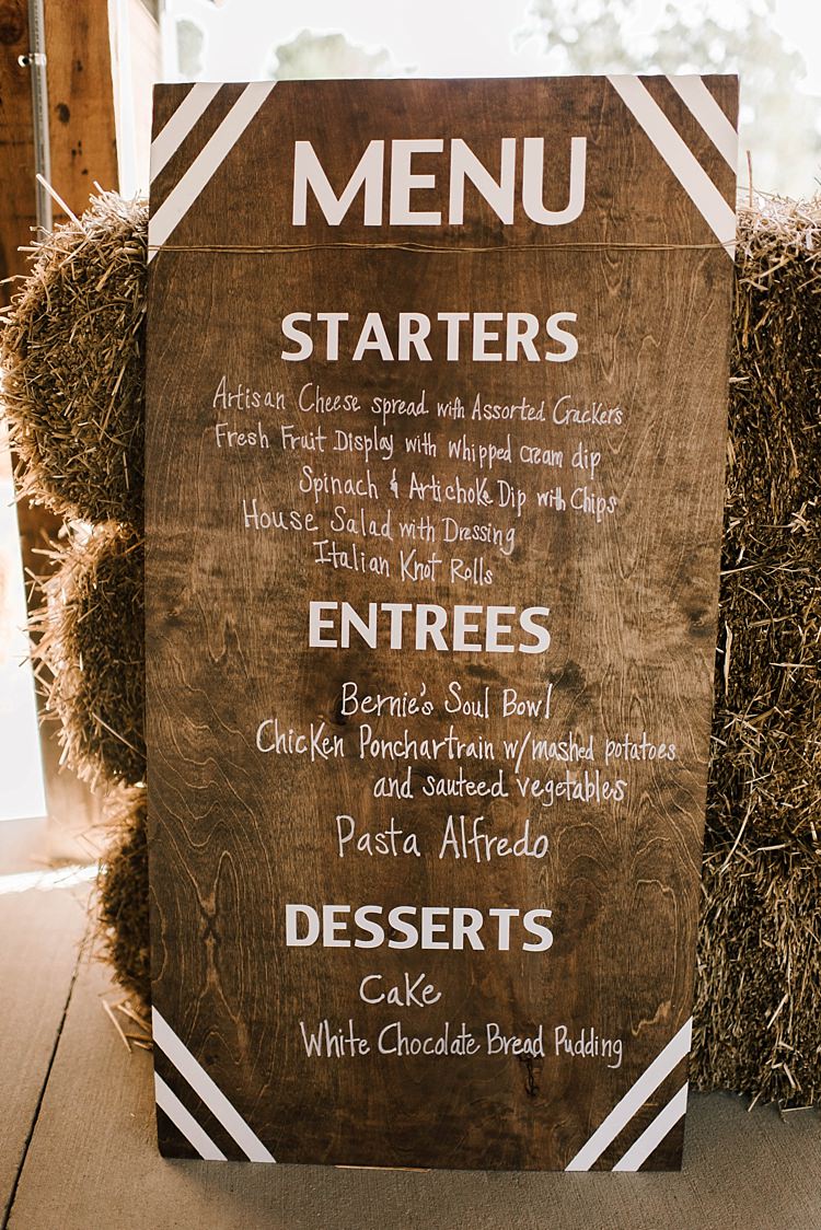 Wooden DIY Menu Sign White Calligraphy Hay Bales Barn Reception Whimsical Boho Outdoor Wedding Alabama http://belightphotography.com/