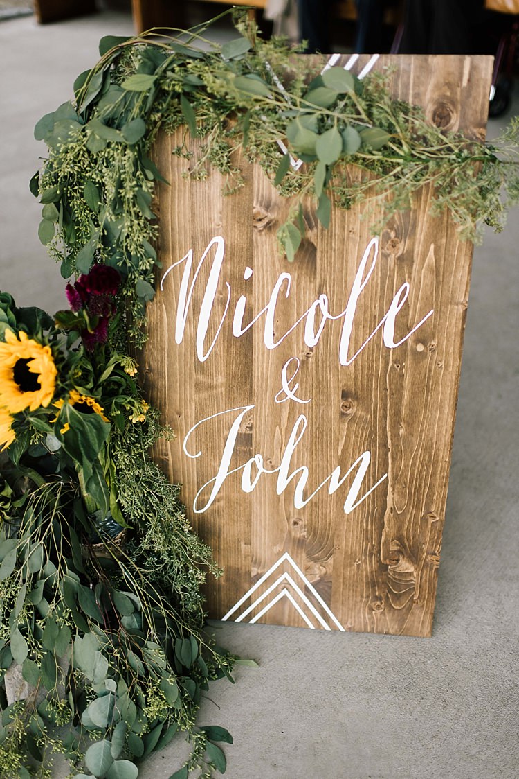 Wooden DIY Sign White Calligraphy Fresh Wild Florals Sunflower Eucalyptus Whimsical Boho Outdoor Wedding Alabama http://belightphotography.com/